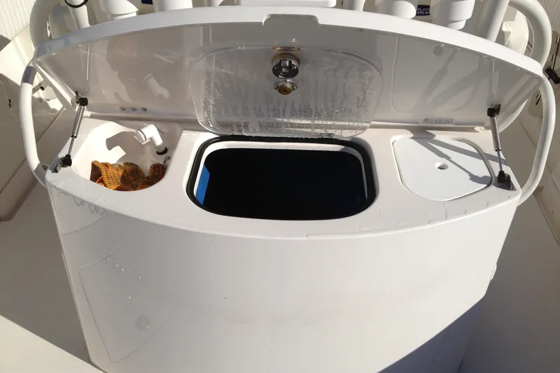 Slide: The Image of Open storage compartment on 2012 Jupiter 29 FS CC boat, featuring a clean design. - 17