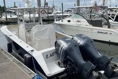 Slide: The Image of 2012 Jupiter 29 FS CC boat docked with twin Yamaha engines. - 8