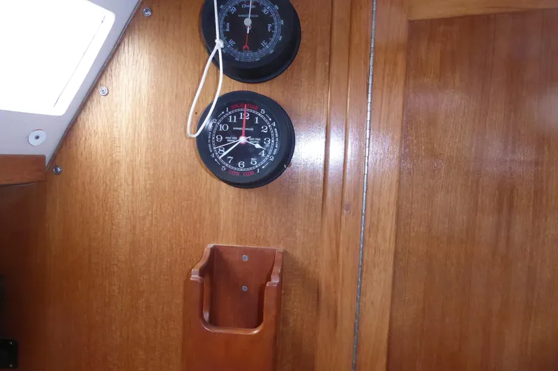 Slide: The Image of Interior of 1998 Catalina 36 MkII sailboat with wooden paneling and nautical instruments. - 10