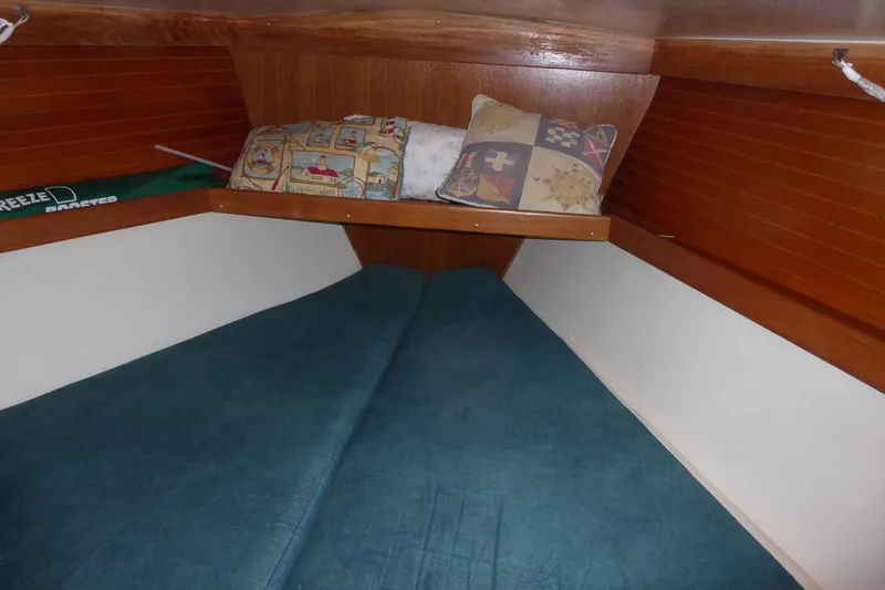 Slide: The Image of Cozy cabin interior of 1998 Catalina 36 MkII sailboat with cushions and wood paneling. - 12