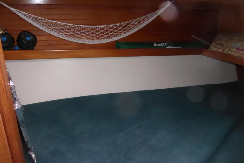 Slide: The Image of Cozy cabin interior of 1998 Catalina 36 MkII sailboat with hammock and storage. - 13