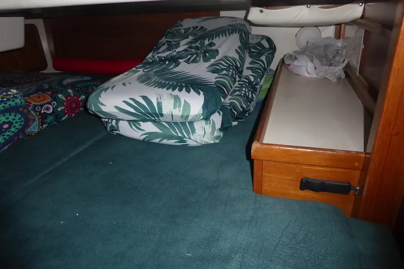 Slide: The Image of Cozy cabin interior of 1998 Catalina 36 MkII with colorful bedding and storage. - 28