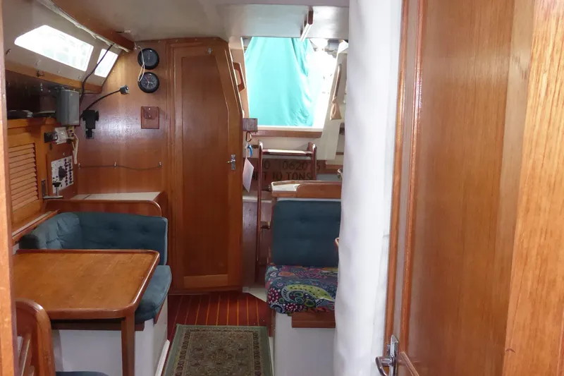 Slide: The Image of Interior of 1998 Catalina 36 MkII sailboat with wooden furnishings and seating area. - 31