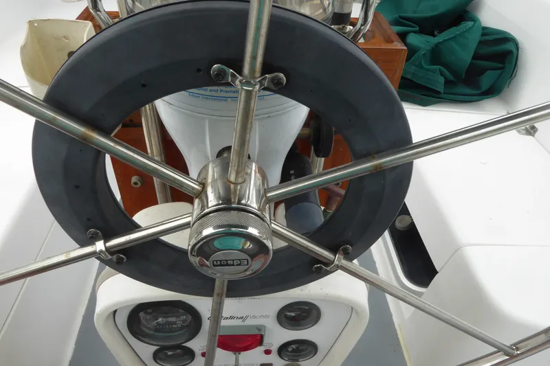 Slide: The Image of Steering wheel of a 1998 Catalina 36 MkII sailboat with navigation instruments. - 37