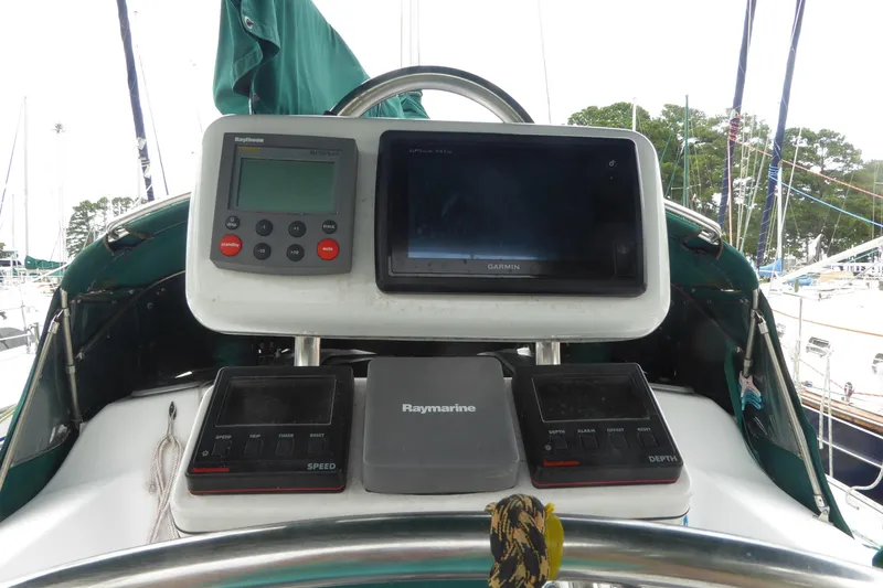 Slide: The Image of Cockpit of 1998 Catalina 36 MkII sailboat with navigation instruments and displays. - 38