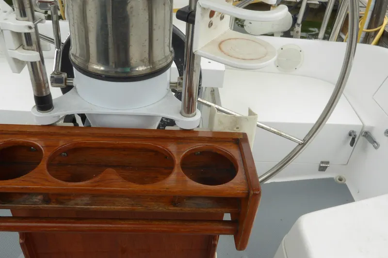 Slide: The Image of Cockpit of 1998 Catalina 36 MkII sailboat with wooden cup holder and steering wheel. - 40