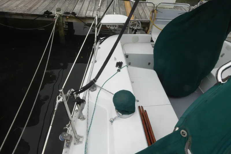 Slide: The Image of 1998 Catalina 36 MkII sailboat docked, featuring deck and rigging details. - 43