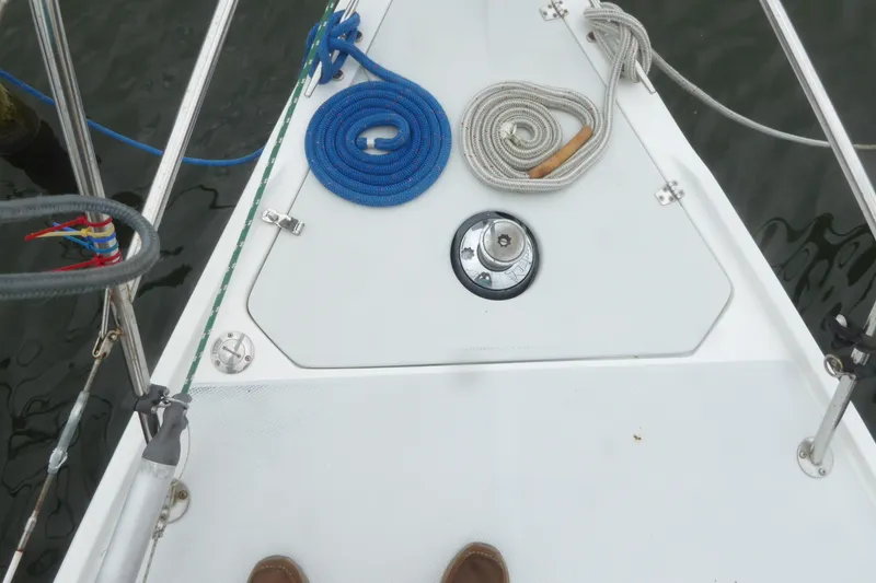 Slide: The Image of Deck of 1998 Catalina 36 MkII sailboat with coiled ropes and winch. - 45
