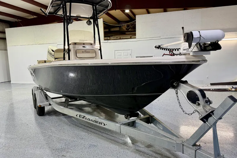 Slide: The Image of 2020 Sea Chaser 23 LX boat on EZ Loader trailer in indoor storage. - 12