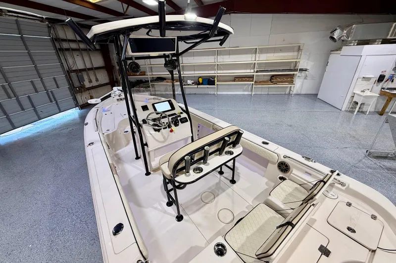 Slide: The Image of 2020 Sea Chaser 23 LX boat interior in a spacious garage setting. - 14