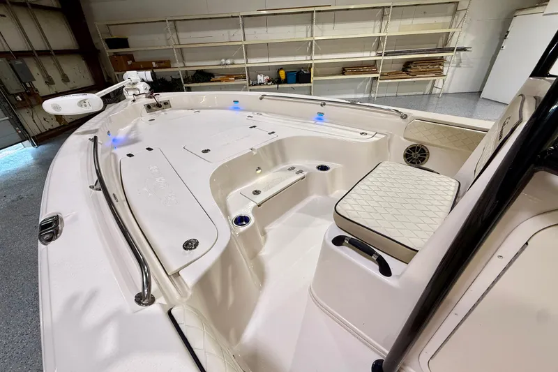 Slide: The Image of 2020 Sea Chaser 23 LX boat interior with seating and storage compartments. - 28
