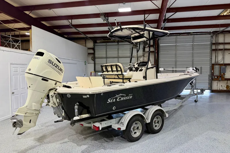 Slide: The Image of 2020 Sea Chaser 23 LX boat with Suzuki engine on trailer in garage. - 3
