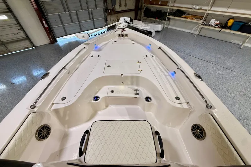 Slide: The Image of 2020 Sea Chaser 23 LX boat interior with storage compartments and sleek design. - 30