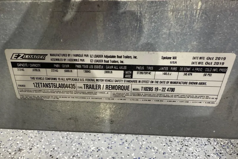 Slide: The Image of EZ Loader trailer label, manufactured October 2019, for Sea Chaser 23 LX, 2020 model. - 36