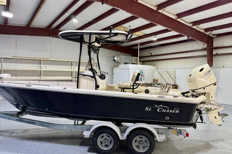 Slide: The Image of 2020 Sea Chaser 23 LX boat on trailer in indoor storage facility. - 9