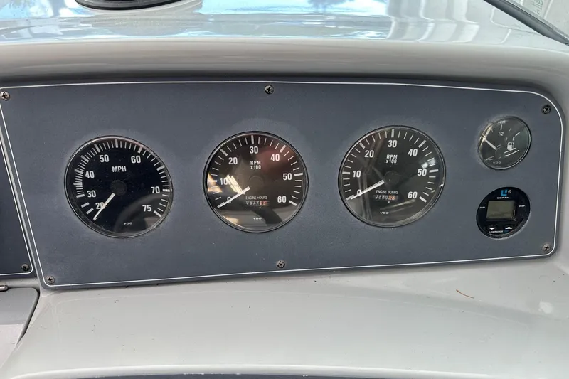 Slide: The Image of Dashboard of a 1997 Formula 330 Sun Sport boat with speedometer and RPM gauges. - 2
