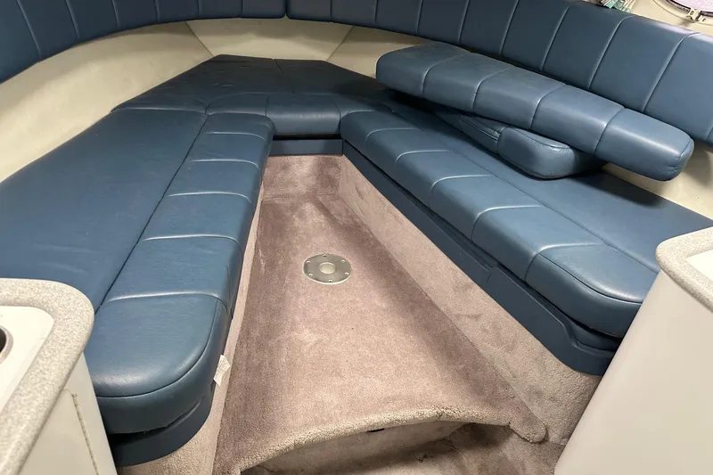 Slide: The Image of Interior of 1997 Formula 330 Sun Sport boat with blue seating and carpeted floor. - 5