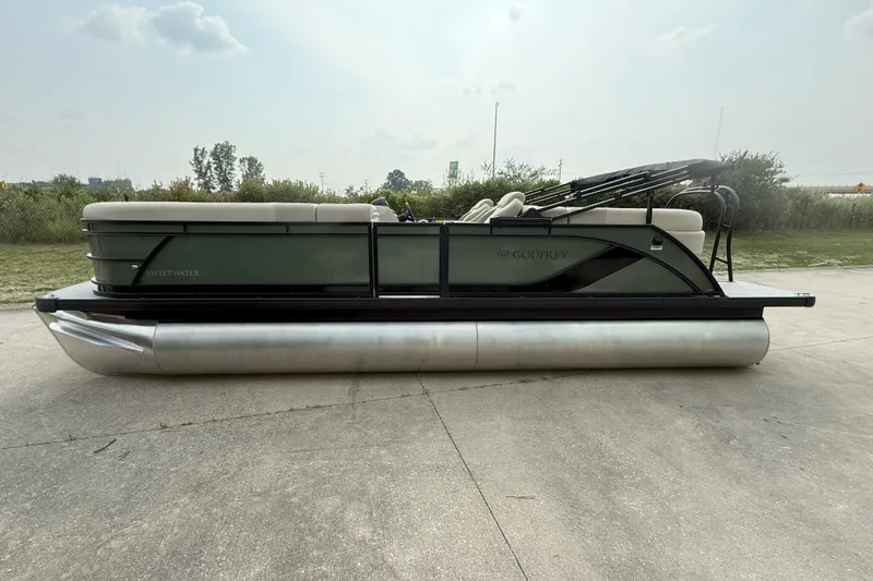 The Image of 2026 Godfrey SW 2286 SB pontoon boat on concrete, side view. - 0