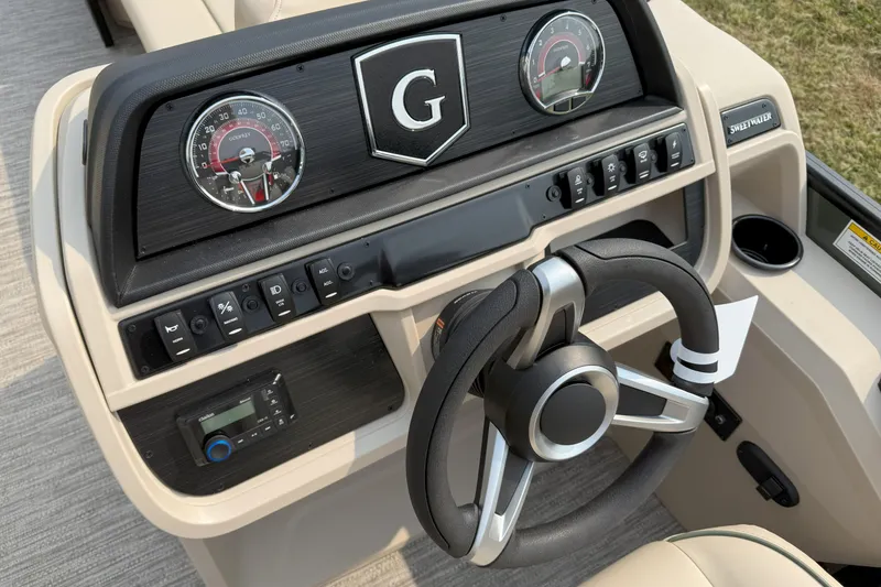 Slide: The Image of Steering console of 2026 Godfrey SW 2286 SB boat with gauges and controls. - 10