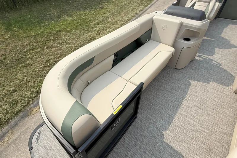 Slide: The Image of 2026 Godfrey SW 2286 SB boat interior with beige seating and carpeted flooring. - 7