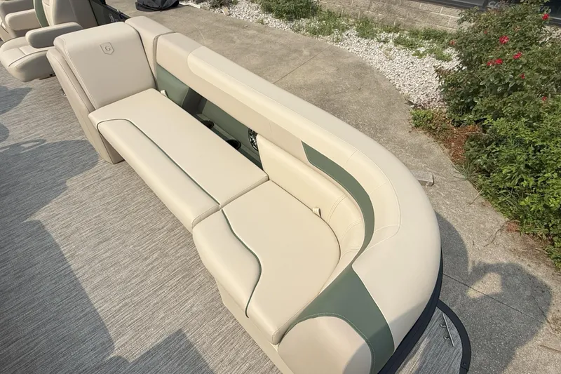 Slide: The Image of 2026 Godfrey SW 2286 SB boat seating with beige and green upholstery. - 8