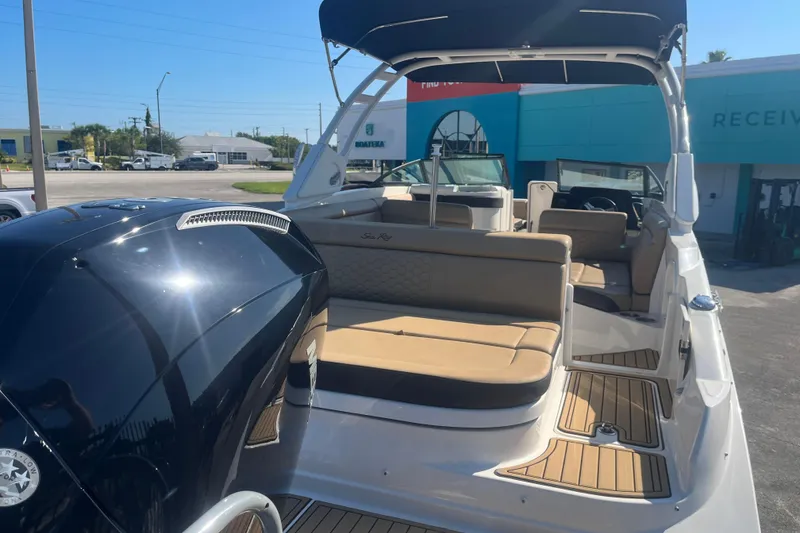 Slide: The Image of 2024 Sea Ray SDX 270 Outboard boat with spacious seating and sleek design. - 12
