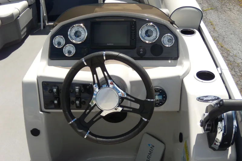Slide: The Image of Steering console of 2020 Starcraft EX 20 C boat with gauges and controls. - 10