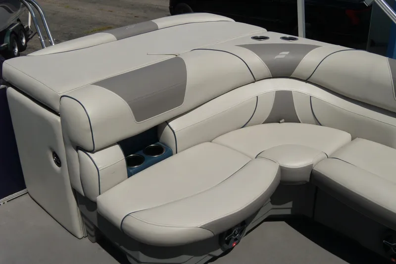 Slide: The Image of 2020 Starcraft EX 20 C boat interior with plush seating and cup holders. - 11
