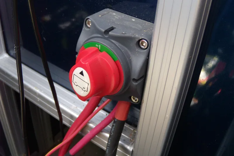 Slide: The Image of Red battery switch on a 2020 Starcraft EX 20 C boat. - 13