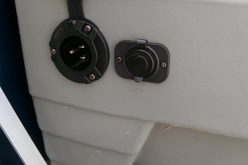 Slide: The Image of 2020 Starcraft EX 20 C boat electrical outlets, featuring NOCO and Marinco connectors. - 15