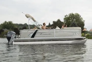 Slide: The Image of Manufacturer Provided Image: 2020 Starcraft EX 20 C pontoon boat on a lake with people onboard. - 26