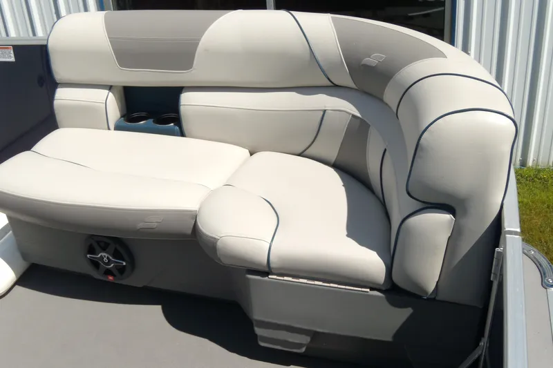 Slide: The Image of 2020 Starcraft EX 20 C boat interior with plush seating and cup holders. - 5