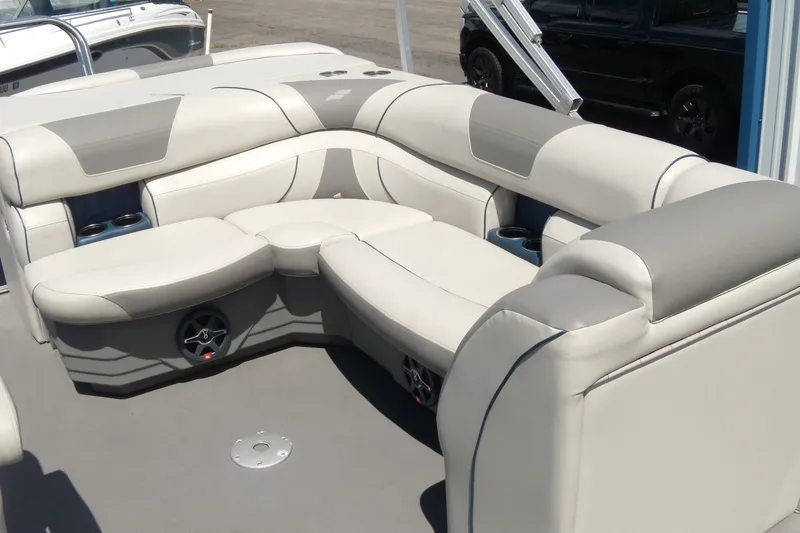Slide: The Image of 2020 Starcraft EX 20 C boat interior with plush seating and cup holders. - 7