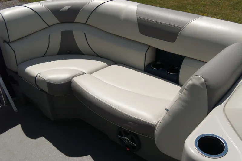 Slide: The Image of 2020 Starcraft EX 20 C boat interior with plush seating and cup holders. - 9