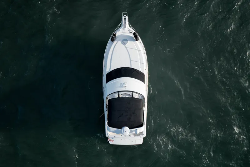 Slide: The Image of Aerial view of 2005 Silverton 34 Convertible boat on open water. - 11