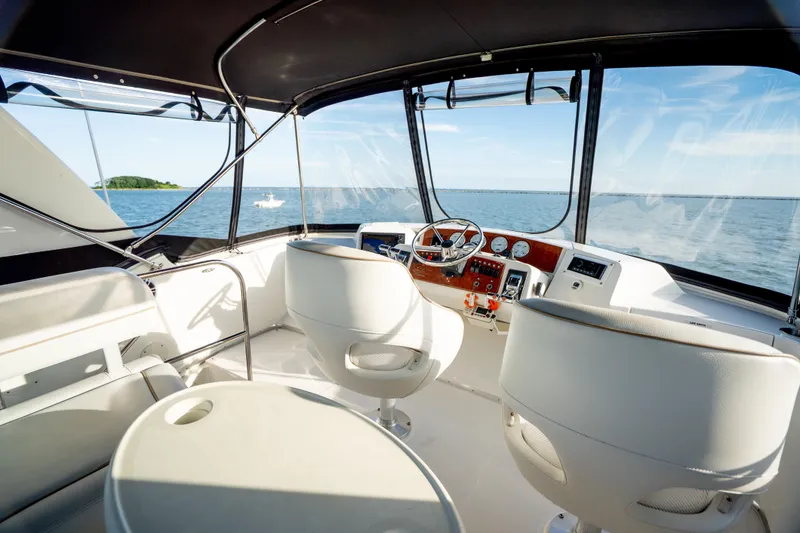 Slide: The Image of Interior view of 2005 Silverton 34 Convertible yacht cockpit with ocean backdrop. - 18