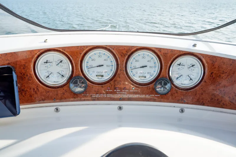 Slide: The Image of Dashboard of a 2005 Silverton 34 Convertible boat with gauges and controls. - 22