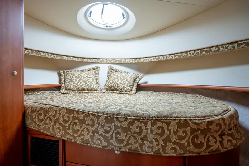 Slide: The Image of Luxurious cabin interior of 2005 Silverton 34 Convertible yacht with elegant bedding. - 33