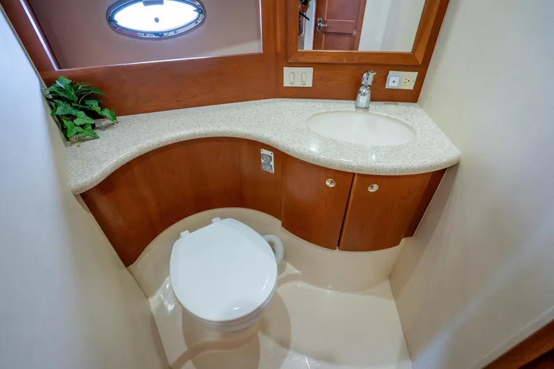 Slide: The Image of Luxurious bathroom in 2005 Silverton 34 Convertible yacht with modern fixtures and elegant design. - 35
