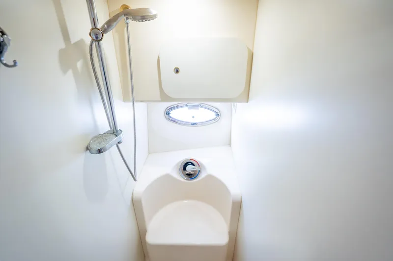 Slide: The Image of 2005 Silverton 34 Convertible yacht bathroom with shower and compact design. - 37