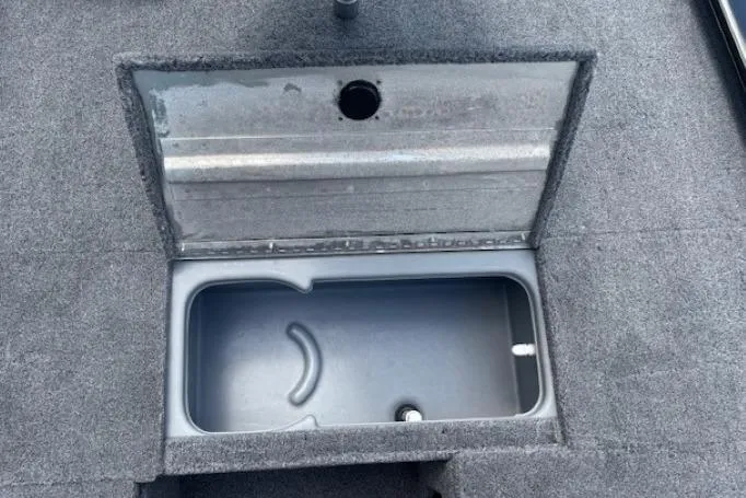 Slide: The Image of 2025 Tracker Pro 170 boat storage compartment with open lid, showcasing interior space. - 11