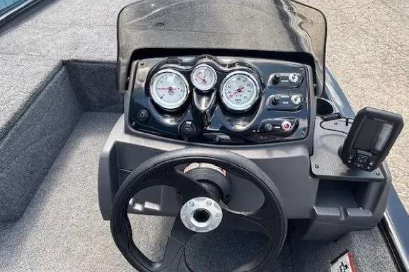 Slide: The Image of 2025 Tracker Pro 170 boat dashboard with steering wheel and gauges. - 15