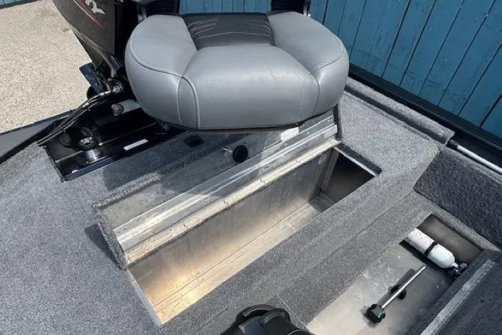 Slide: The Image of 2025 Tracker Pro 170 boat interior with storage compartments and seating. - 19