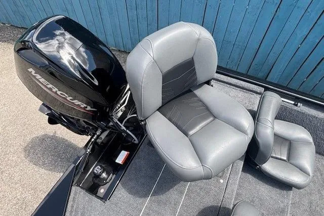 Slide: The Image of 2025 Tracker Pro 170 boat with Mercury engine and gray seating, viewed from above. - 20