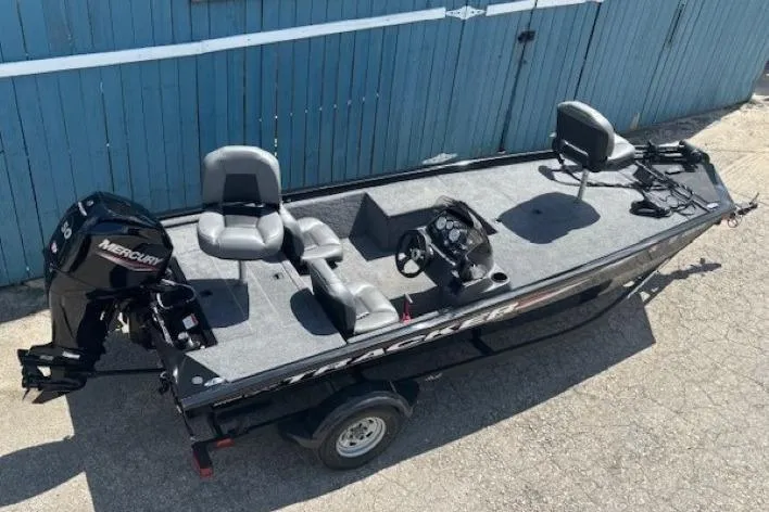 Slide: The Image of 2025 Tracker Pro 170 fishing boat with Mercury engine, parked on a trailer. - 6