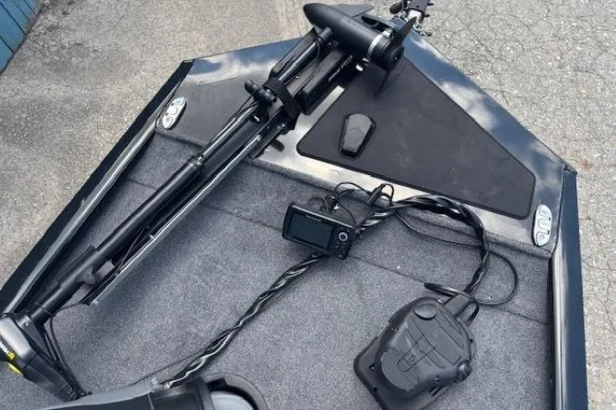 Slide: The Image of 2025 Tracker Pro 170 boat deck with mounted equipment and controls. - 8