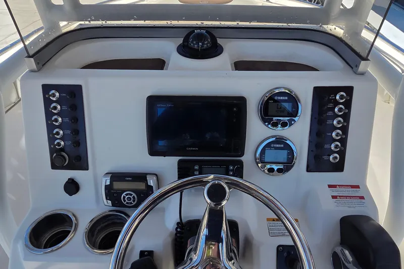 Slide: The Image of 2017 Robalo R222 Center Console dashboard with Garmin display and Yamaha gauges. - 4