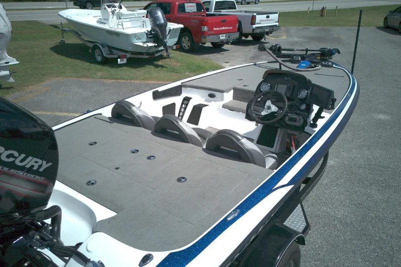 Slide: The Image of 2015 Nitro Z-7SC boat with Mercury engine, parked outdoors. - 6