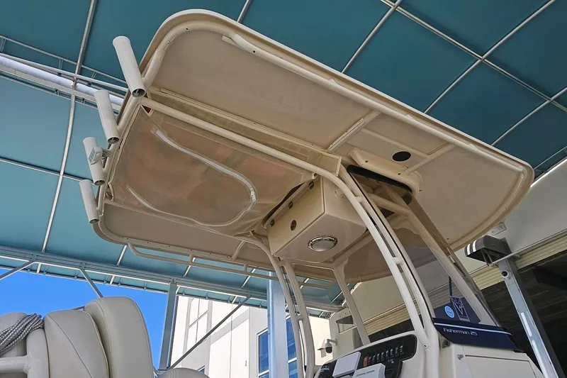 Slide: The Image of 2017 Grady-White Fisherman 257 boat with T-top and console, under blue canopy. - 12