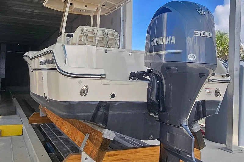 Slide: The Image of 2017 Grady-White Fisherman 257 with Yamaha 300 engine in storage facility. - 2